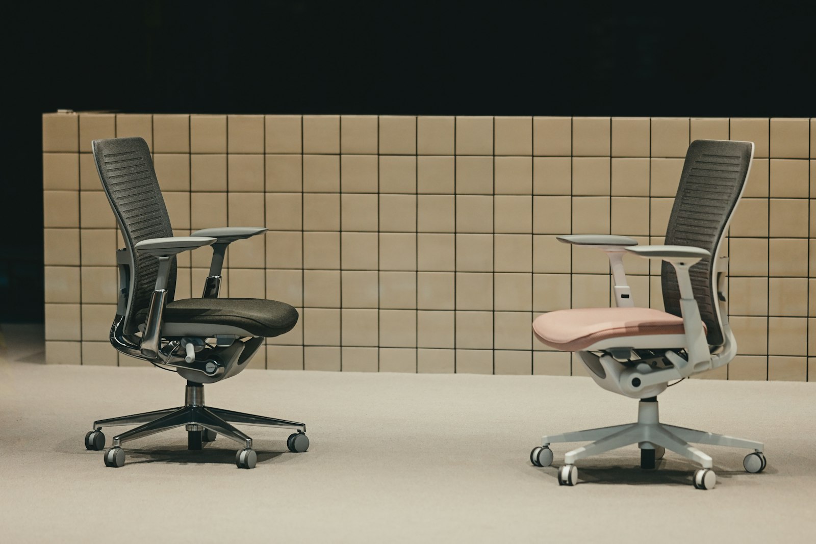 Two premium office chairs side by side